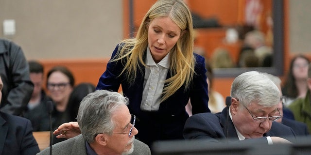 Gwyneth Paltrow speaks with retired optometrist Terry Sanderson as she walks out of the courtroom following the reading of the verdict in the ski collision trial.