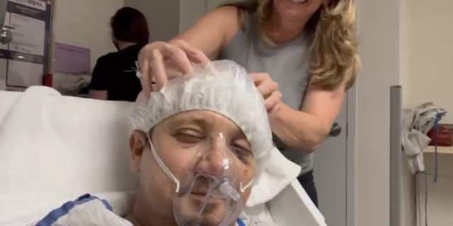 Jeremy Renner shared a photo of himself getting his head massaged while wearing a hairnet, breathing medical mask and lying down on the hospital bed. He thanked his mom and sister for their love.