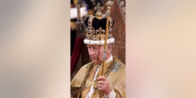 King Charles III is crowned with St Edwards Crown during his coronation ceremony