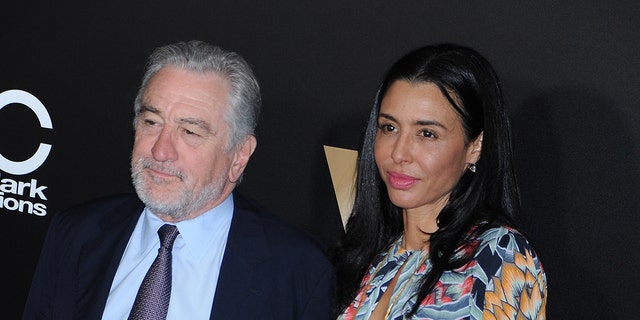 Robert De Niro with his eldest daughter Drena, on the red carpet looking away from the camera at the Hollywood Film Awards