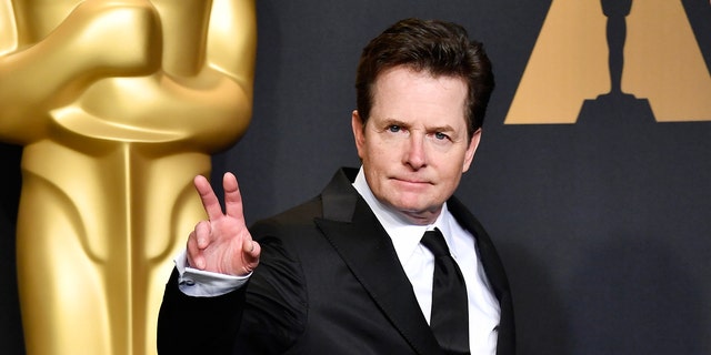 Michael J Fox held up a peace sign on the red carpet at the Oscars in 2017.