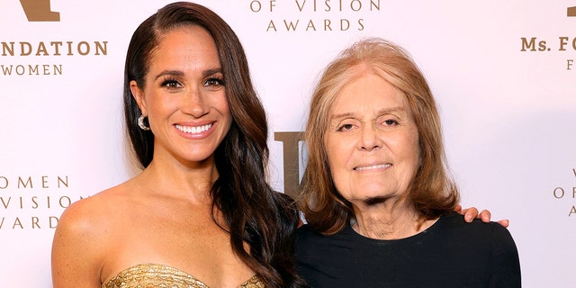 Meghan Markle sparkles in gold dress, Gloria Steinem wears black shirt for foundation event in New York