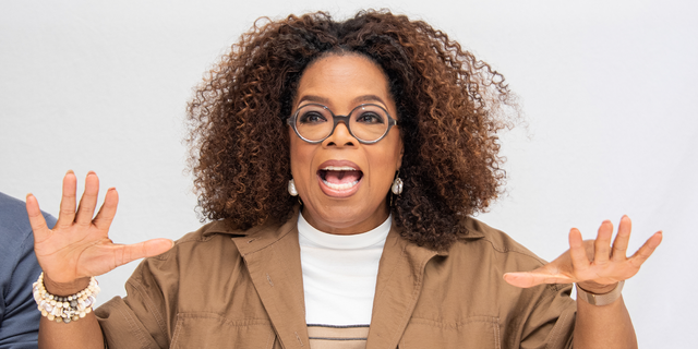 Oprah Winfrey uses her hands in an animated chat