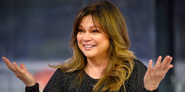 Valerie Bertinelli in a black sparkled top with her hands up in the air while on TODAY