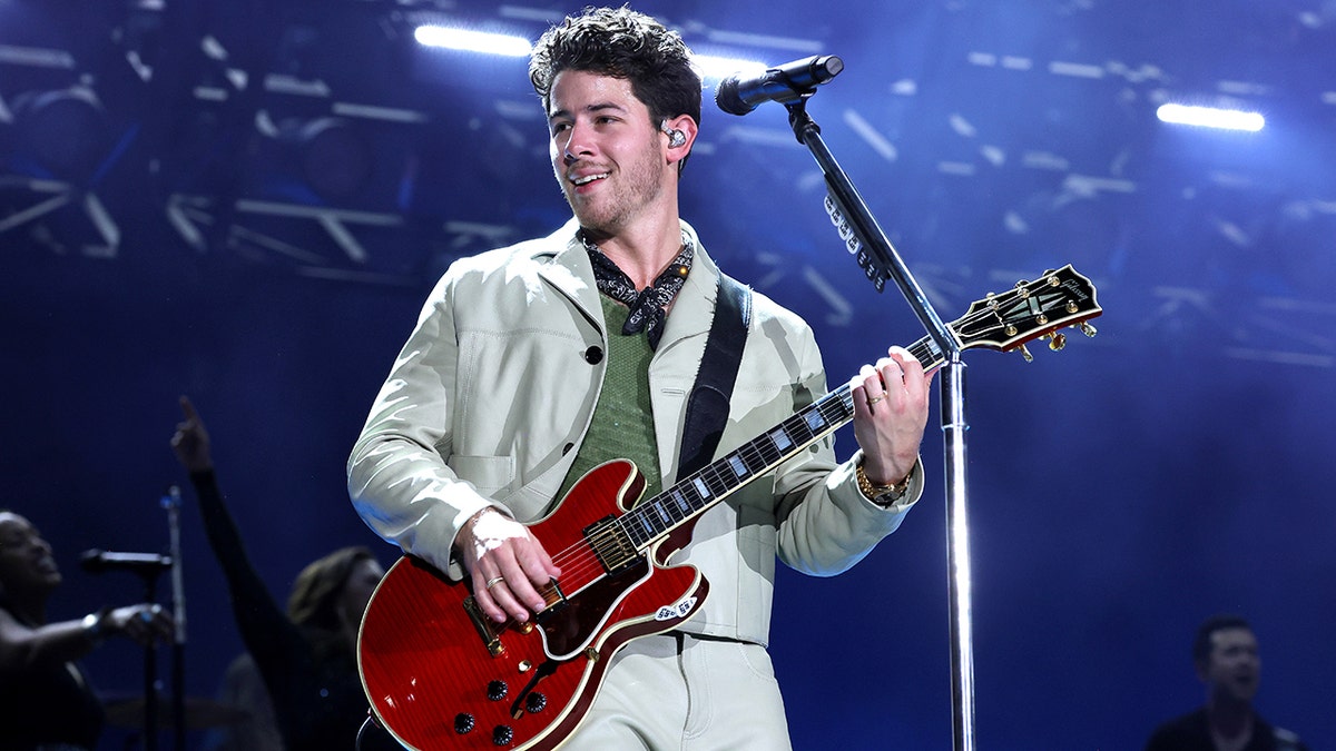 Nick Jonas performing on stage