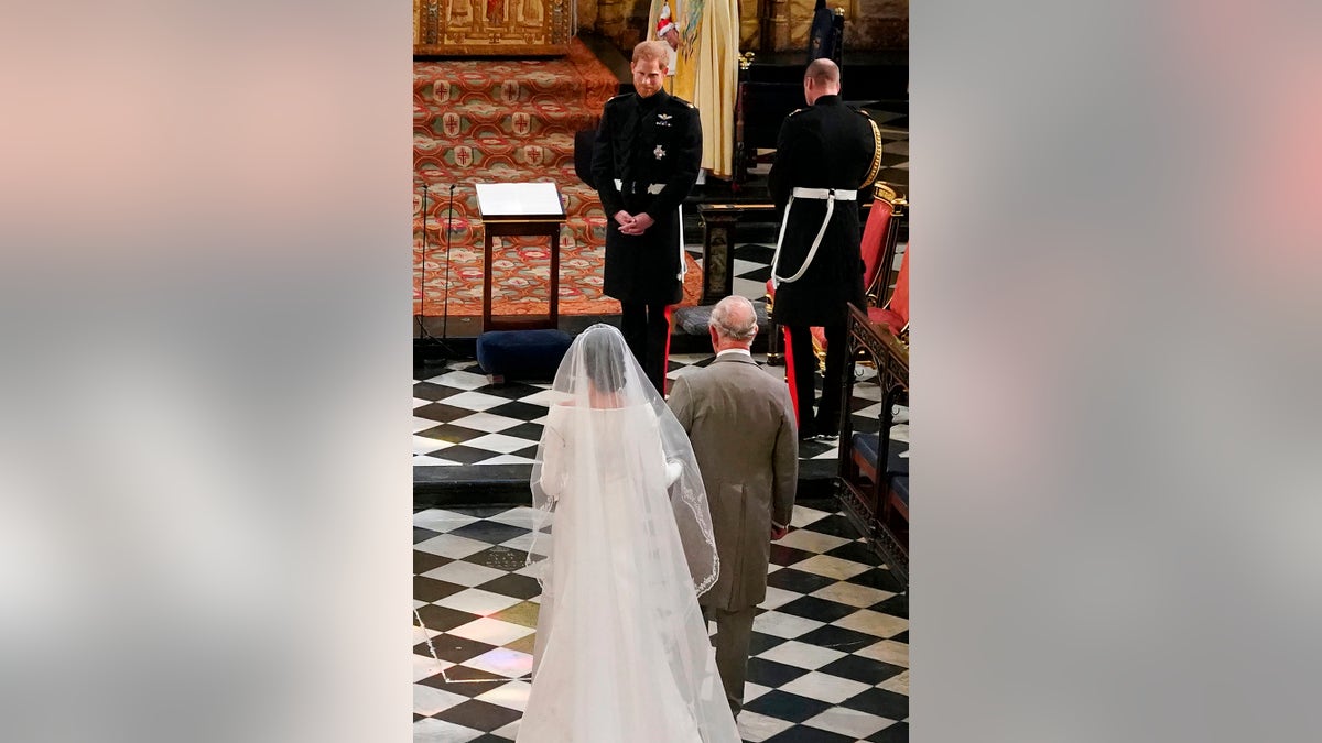 King Charles walking Meghan Markle down the aisle on her wedding day