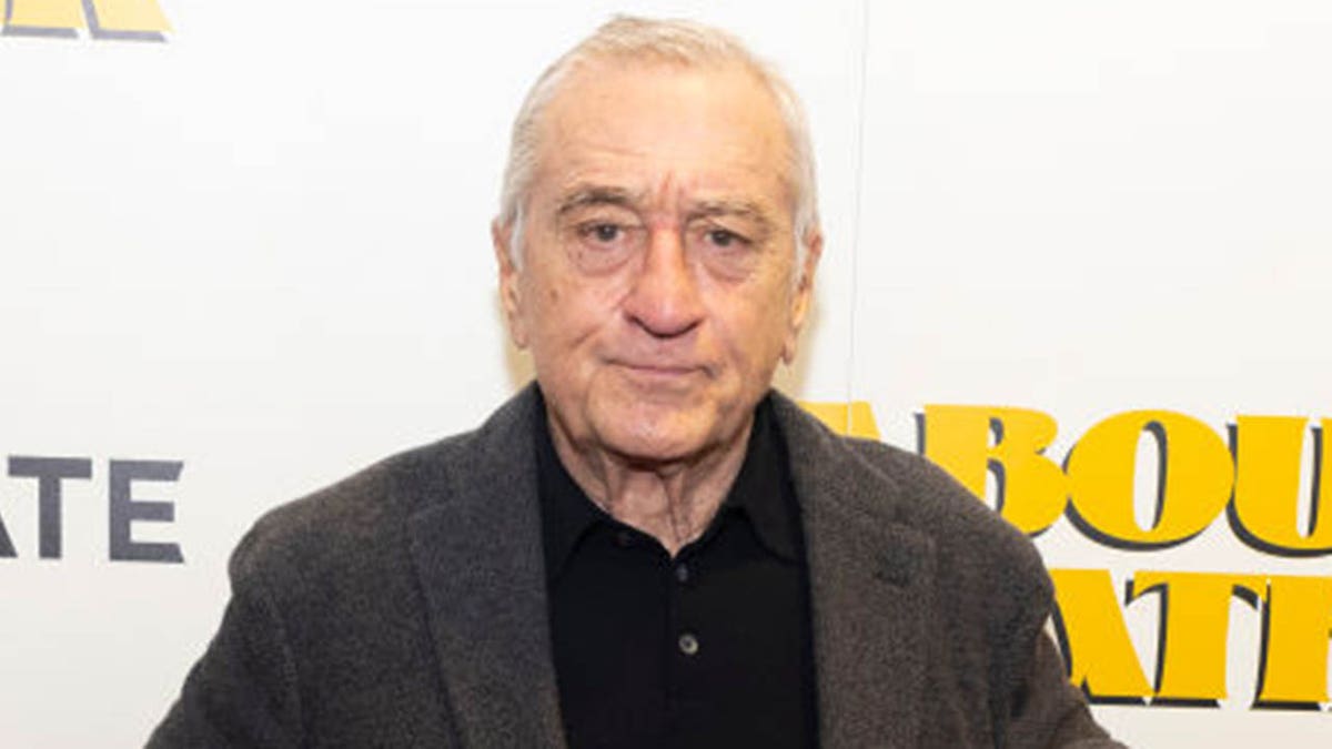 Robert De Niro with a stern look on his face on the carpet for his film "About My Father'