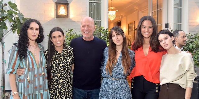 Bruce Willis and ex-wife Demi Moore have remained a united front for their family more than 20 years after their divorce. Daughters Rumer, Scout and Tallulah joined him and wife Emma Heming at Demi's book launch in 2019.