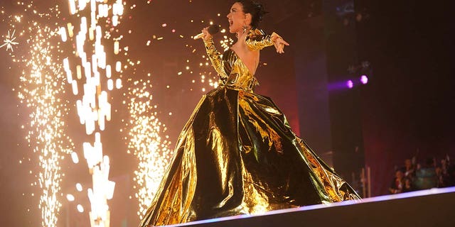 Katy Perry wears gilded gown for coronation concert at Windsor Castle.