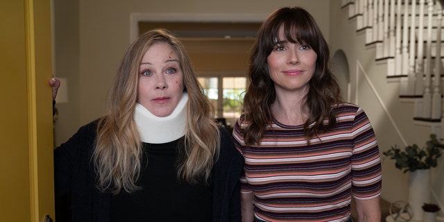 Christina Applegate in a neck brace as Jen on "Dead to Me" with Linda Cardellini in a striped shirt as Judy