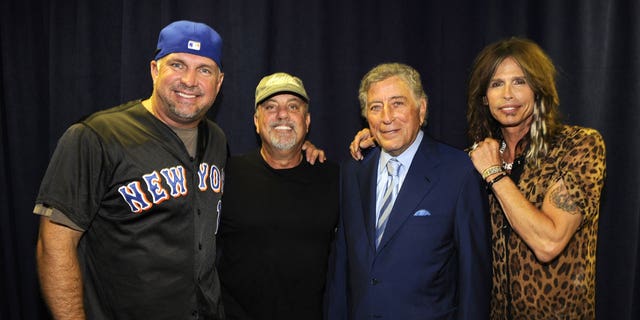 Garth Brooks backstage with Billy Joel and others