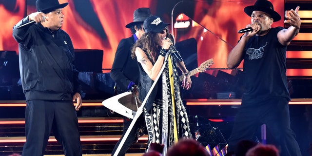 Aerosmith performs at the 62nd Grammy Awards, with Steven Tyler center stage singing