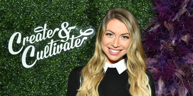 Stassi Schroeder smiling at an event