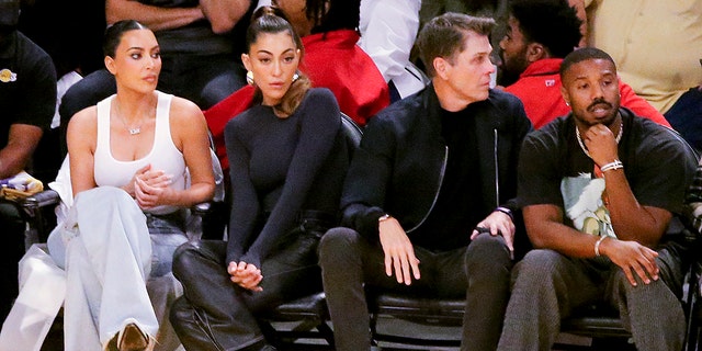 Kim Kardashian sits next to designer Sarah Staudinger and two people over is Michael B. Jordan, all sitting courtside at the Lakers game