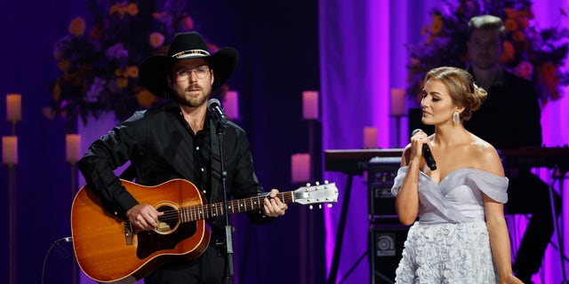 Lukas Nelson and Emmy Russell perform onstage during "Coal Miner's Daughter: A Celebration of the Life &amp; Music of Loretta Lynn" in October.