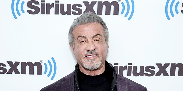 Sylvester Stallone in front of a Sirius XM backdrop