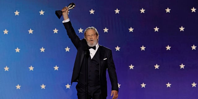 Jeff Bridges holds up Critics Choice Lifetime Achievement award