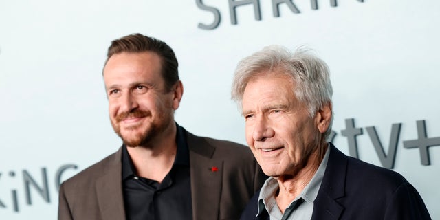 Jason Segel and Harrison Ford smile together at the premiere of their show "Shrinking"