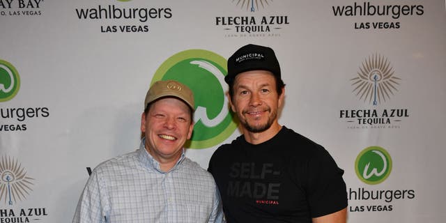 Wahlberg credited his brother Chef Paul, left, with "creating the quality that people have come to know and expect" from Wahlburgers.