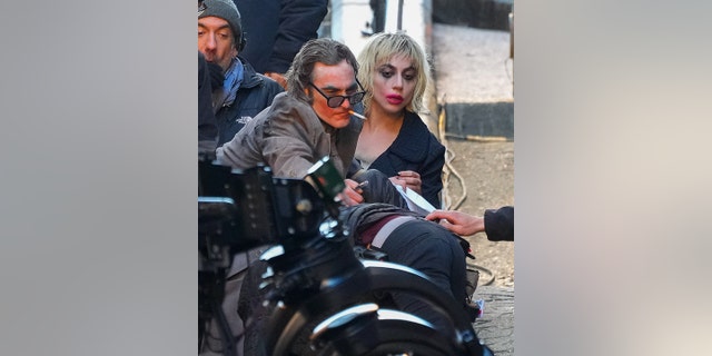 Joaquin Phoenix and Lady Gaga in costume filming for the "Joker" sequel.