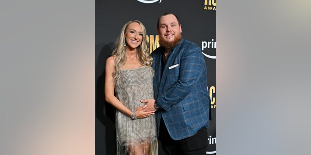 Luke Combs and wife Nicole Hocking cradle her baby bump