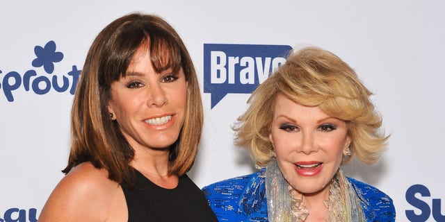 Melissa Rivers in a black top and Joan Rivers in a blue jacket