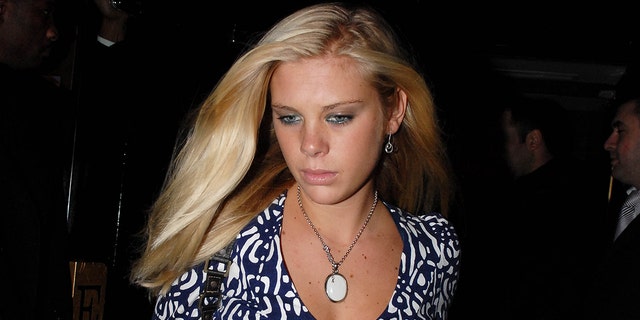 A close-up of Chelsy Davy wearing a patterned dress