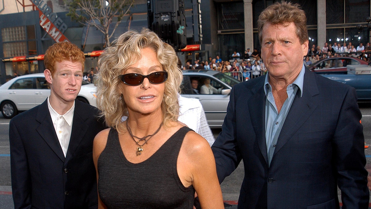 Farrah Fawcett (center), son Redmond and Ryan O'Neal at the Graumans Chinese Theater in Hollywood, California