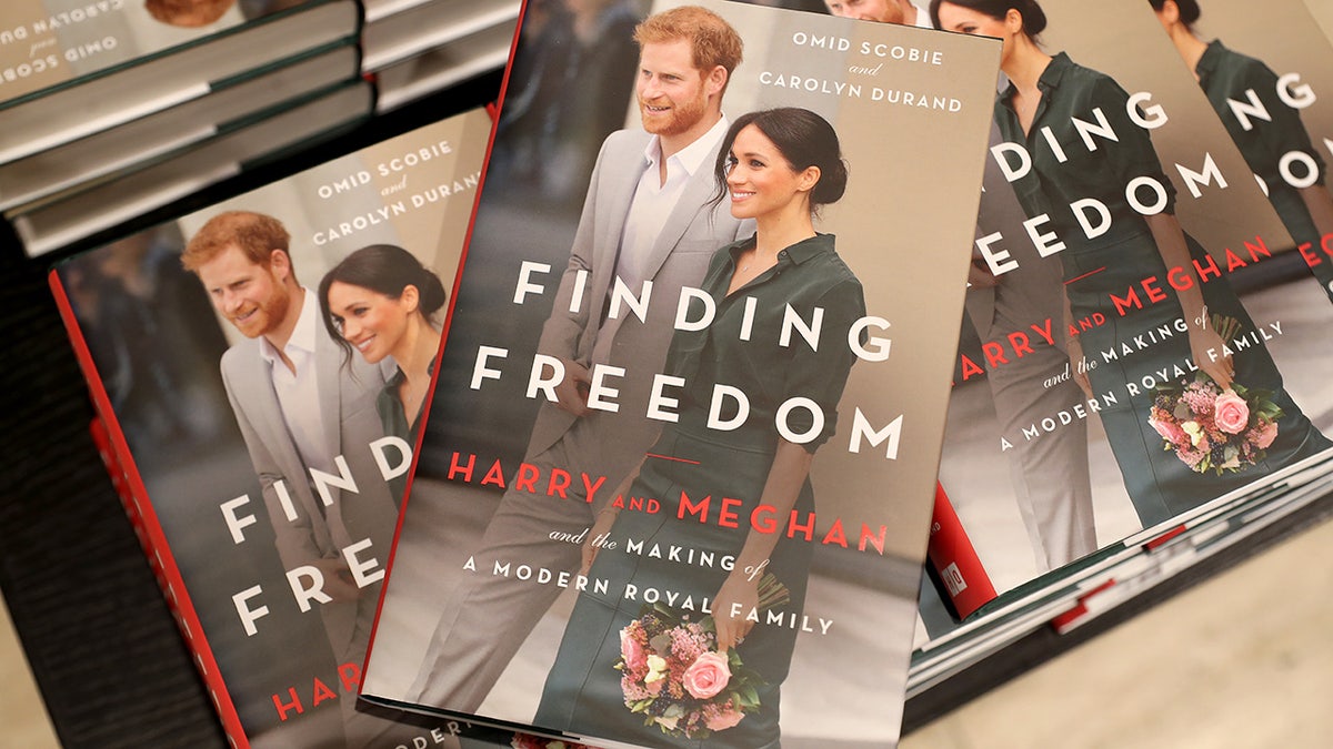 Copies of Finding Freedom on top of a table
