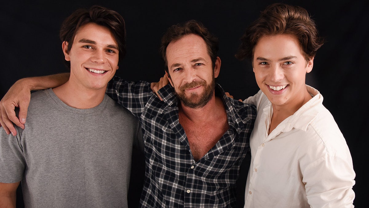 Luke Perry embracing his Riverdale castmates