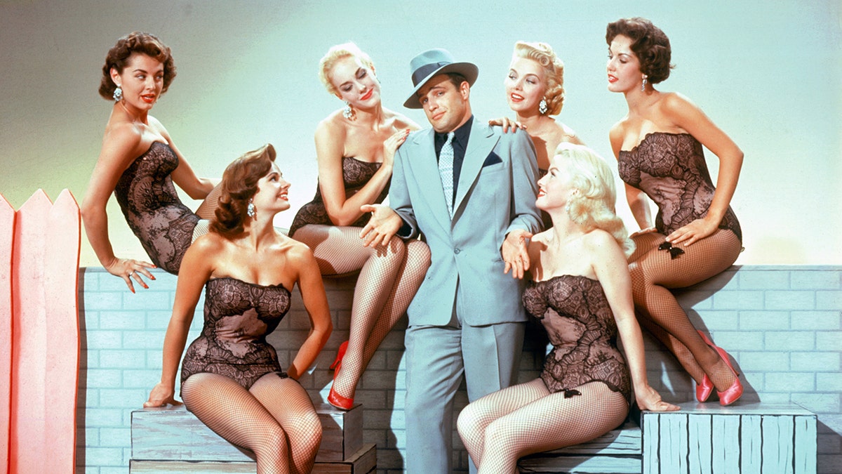 Marlon Brando surrounded by women in lingerie