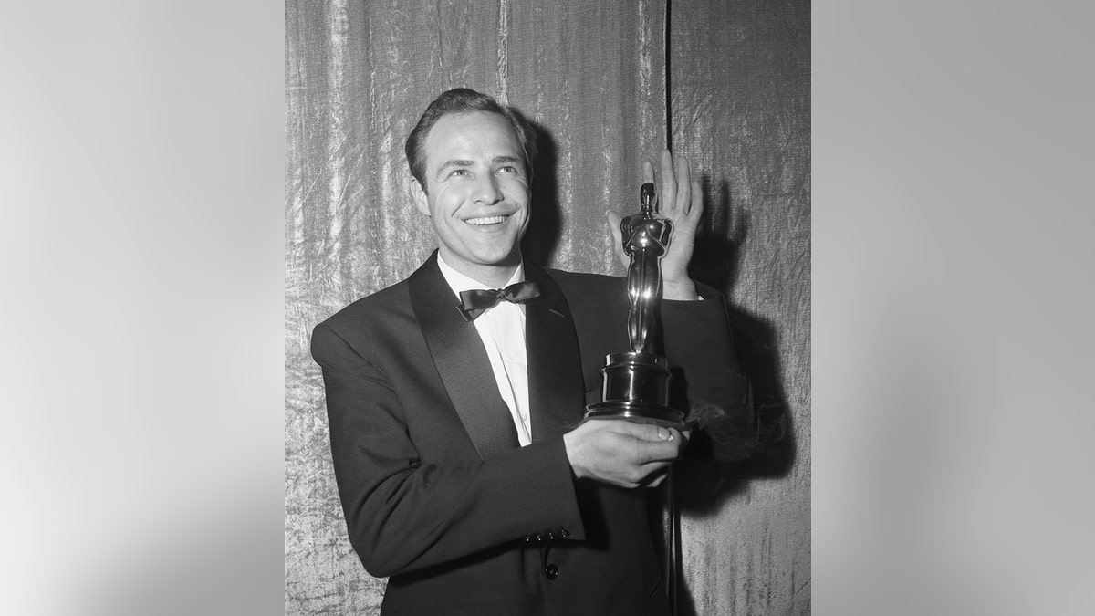 Marlon Brando holding an Oscar