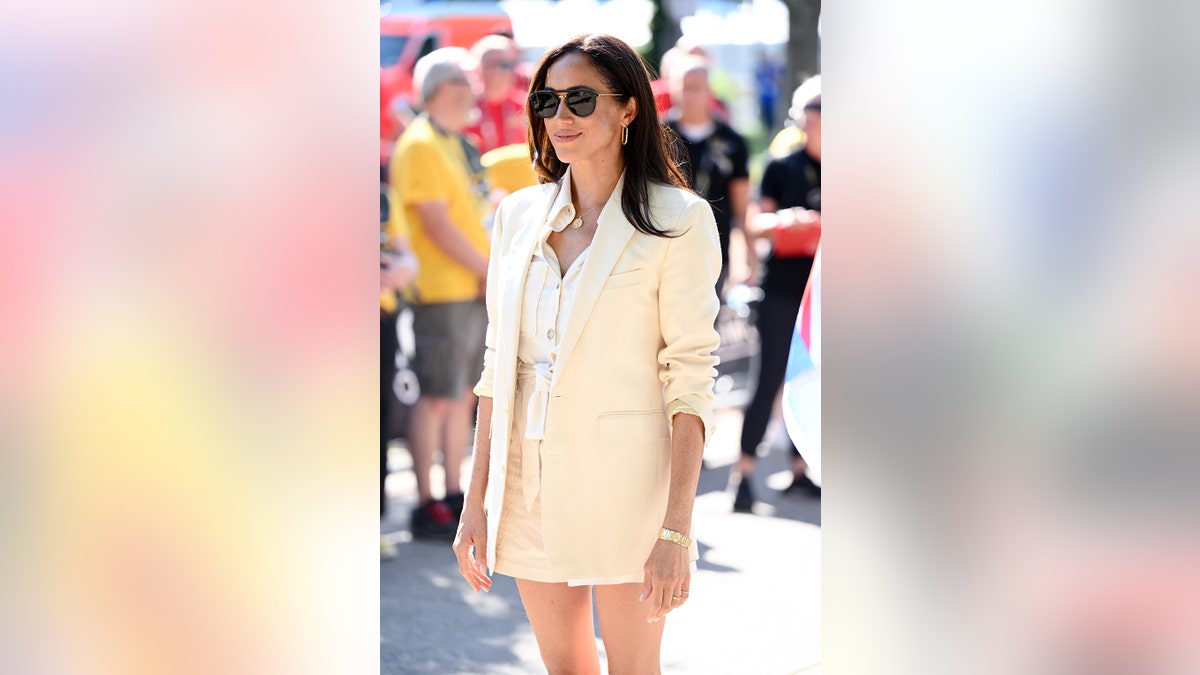 Meghan Markle in an all-ivory outfit with sunglasses