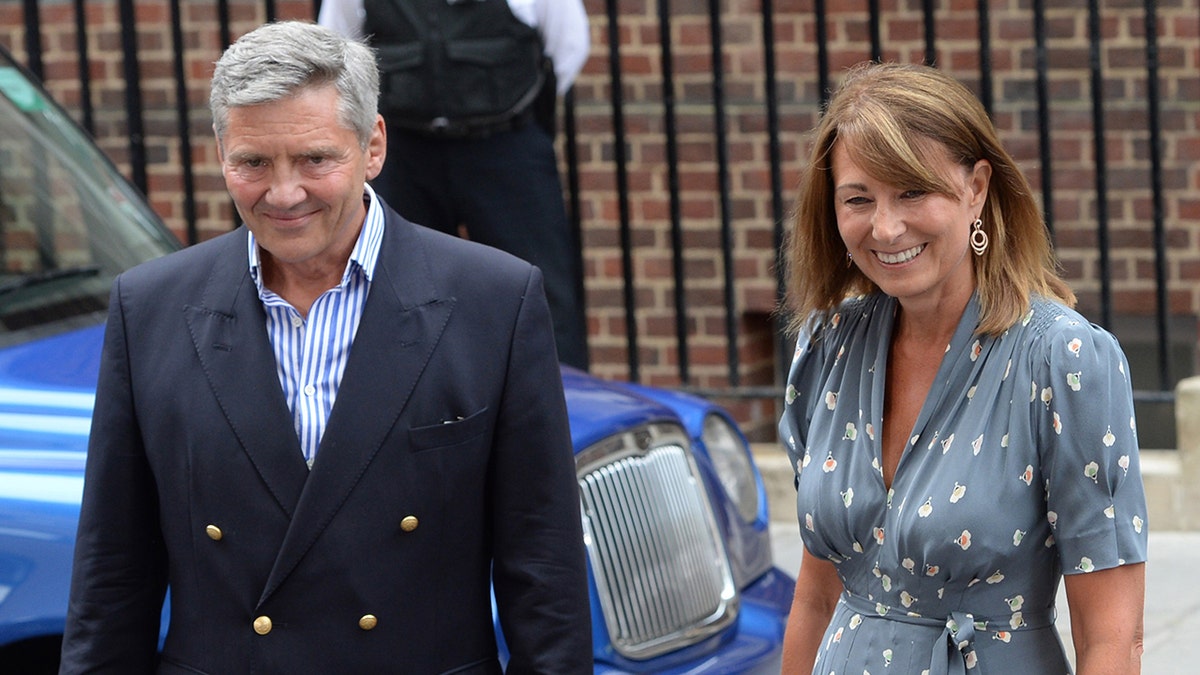 Michael Middleton and Carole Middleton standing next to each other and smiling