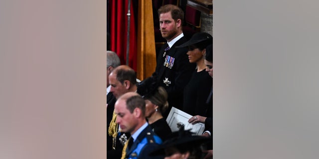 Prince Harry, Duke of Sussex and Meghan, Duchess of Sussex attend the state funeral of Queen Elizabeth II at Westminster Abbey on Sept. 19, 2022, in London.
