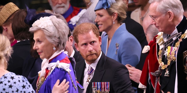 Prince Harry making a funny face in his morning suit