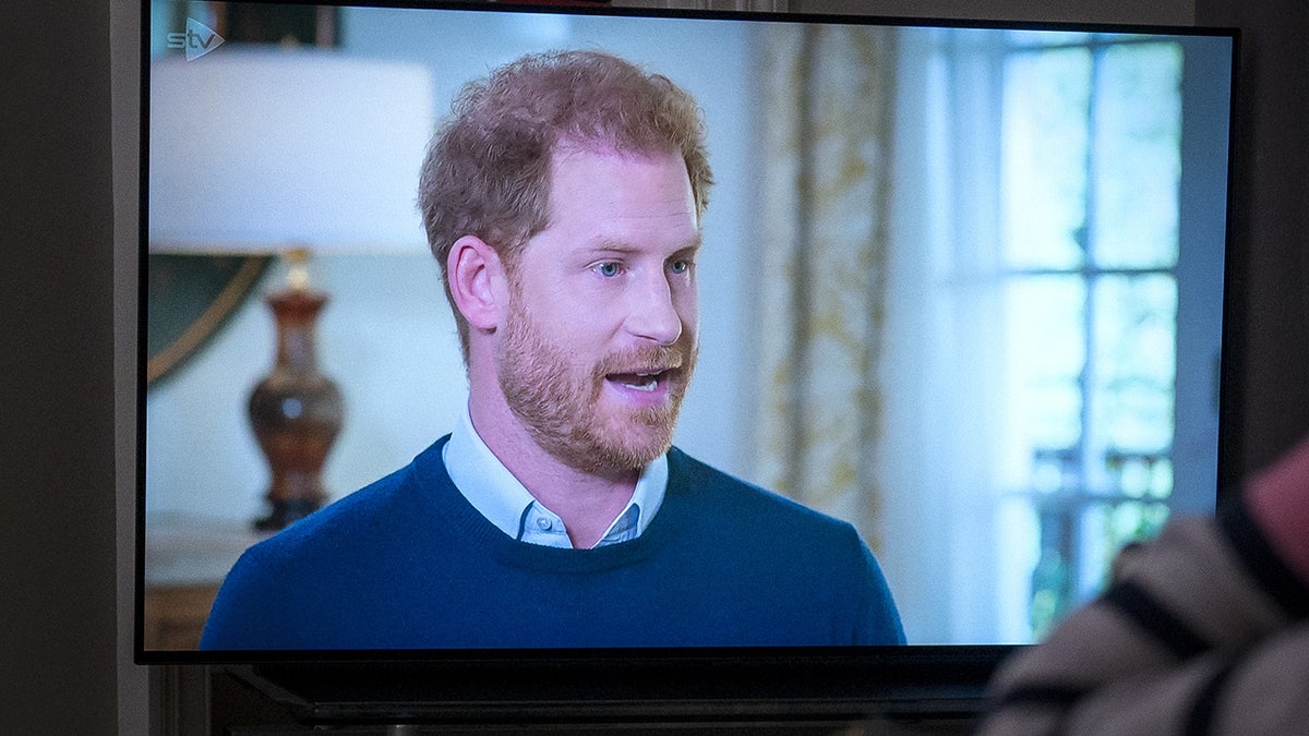 A person at home in Edinburgh watching the Duke of Sussex being interviewed by ITVs Tom Bradby