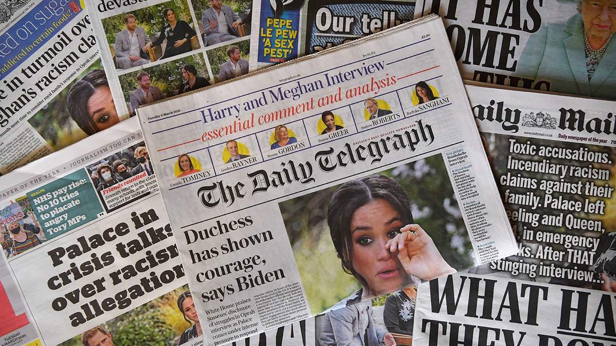 An arrangement of UK daily newspapers photographed as an illustration