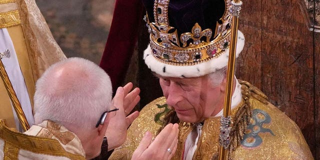 King Charles III is crowned with St Edwards Crown by The Archbishop of Canterbury