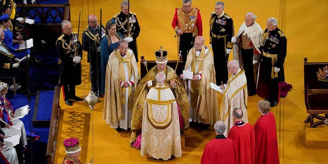 King Charles III receives The St Edward's Crown during his coronation ceremony in Westminster Abbey, London.