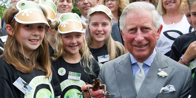 King Charles holding his frog species at WWF Green Ambassadors Scheme
