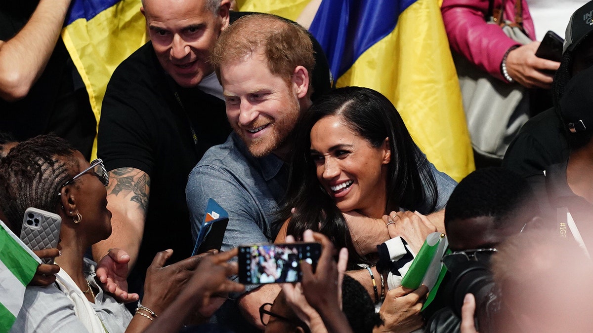 Prince Harry and Meghan Markle watch volleyball