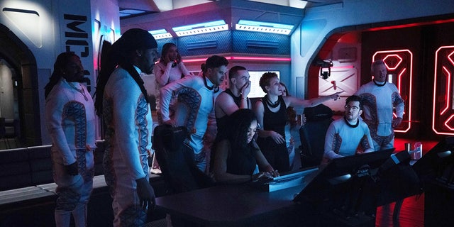 Rumer Willis and Adam Rippon wear black tank tops while manning deck in Mars mission