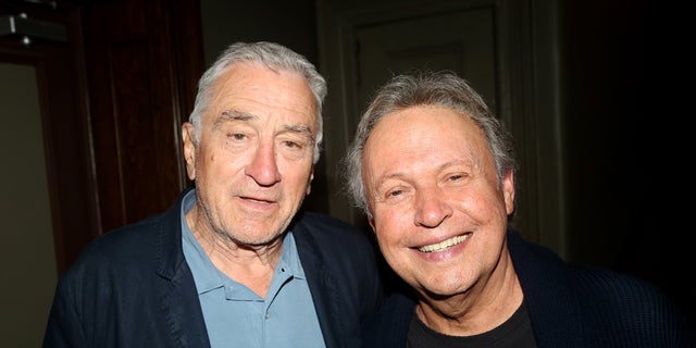 Robert De Niro poses for a photo with friend and former costar Billy Crystal.