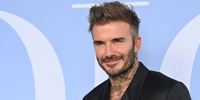 David Beckham posing for a photo