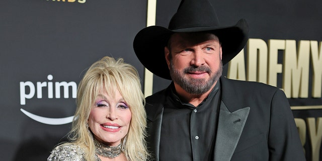 Dolly Parton and Garth Brooks on the 2023 ACM red carpet
