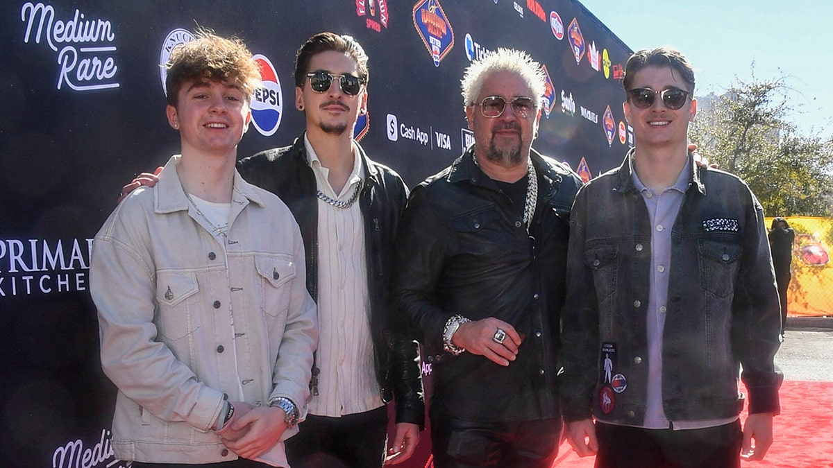 Guy Fieri with his sons Ryder and Hunter and nephew Jules at his Tailgate before the Super Bowl