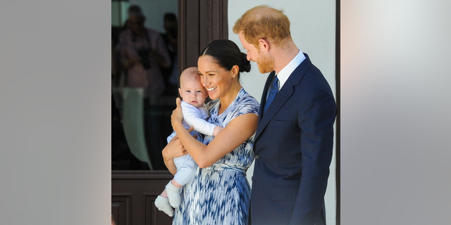 Meghan Markle holding baby Archie with Prince Harry