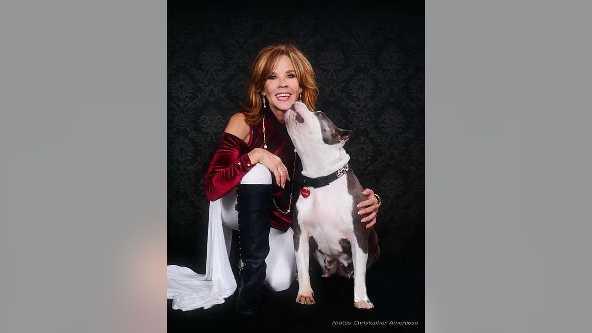 Linda Blair poses with dog