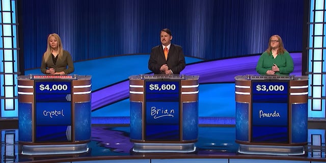 "Jeopardy!" contestants, including Brian Henegar, on Tuesday's show.